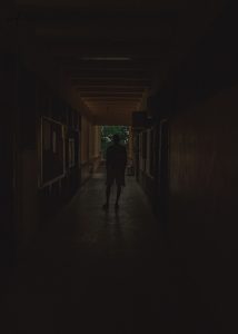 an image of a boy within the shadows