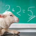 image of a goat with a blackboard background that says 2+2=5